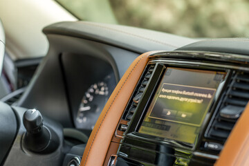 Obraz premium Modern car media display in the interior of the car. Touchscreen monitor on the dashboard of the modern car.