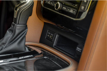 USB port in the car panel close up. Car interior detail. Car usb charger detail.
