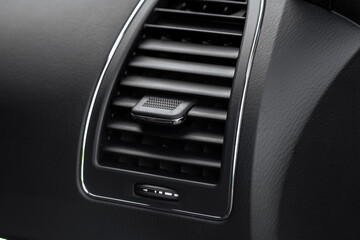 Car air conditioning close up view. The air conditioner flow inside the car. Detail interior of...