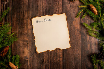 Christmas letter to Santa Claus on a wooden background