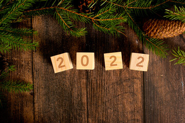 Christmas background. the year 2022 on wooden cubes.