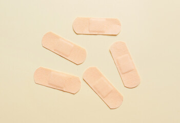 Medical plasters on color background