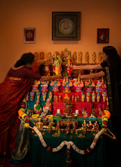 Mother daughter decorating for festival 
