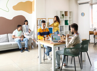 Young business co-workers in office