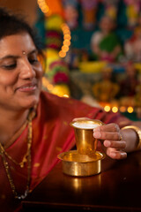 Indian woman enjoying south Indian filter coffee 
