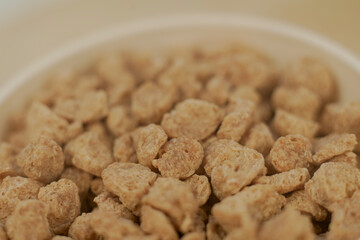 Closeup of textured soy protein. Textured vegetable protein.
Soy meat for a vegan diet