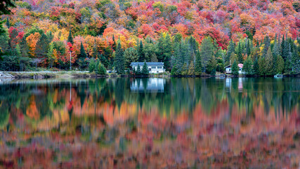 Lac Creuxl in Autumn showing fall colors in cottage country, Quebec Canada. - 465402546