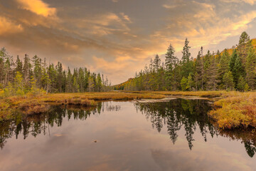 Lac St Michel in Autumn showing fall colors in cottage country, Quebec Canada. - 465402547
