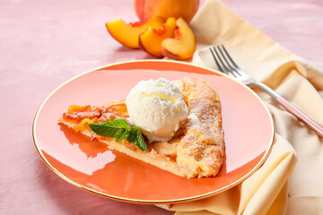 Plate with piece of tasty peach galette and ice cream on color background, closeup