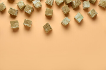 Tasty hojicha marshmallows on color background