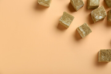 Tasty hojicha marshmallows on color background