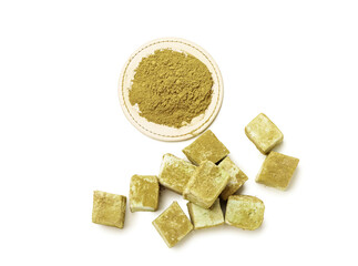 Tasty hojicha marshmallows and powder on white background