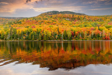 Mount Kaaikop in the background with Lac Legault showing the Autumn fall colors in the water reflection, Quebec, Canada. - 465405123