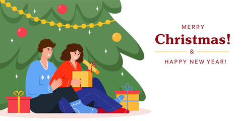 Happy people open gift box near Christmas tree. Merry Christmas and New Year greeting card or banner.