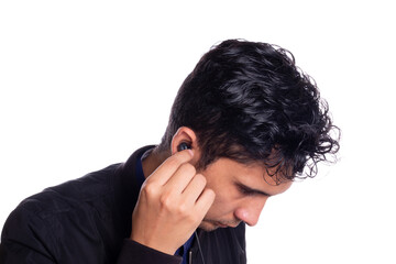 Fototapeta premium Man putting on headphones isolated on white background. Young latino guy using or putting on headphones to listen to music.