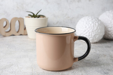 Blank cup on light background