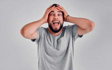 Young man in the studio on a gray background