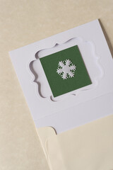 die cut paper card with fancy window opening and fabric snowflake