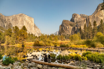 Contemplating El Capitan and Yosemite Valley in Autumn, Granite Mountains from Valley View vista...