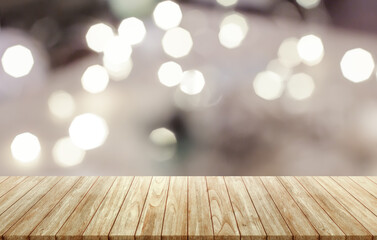 Naklejka na ściany i meble Empty wooden table on room with bokeh blurred background.
