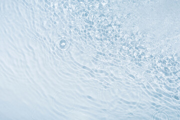 Blue water background with drops and splashing water and blurry circles, great creative design.
