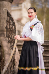 Young beautiful slovak woman in traditional dress. Slovak folklore