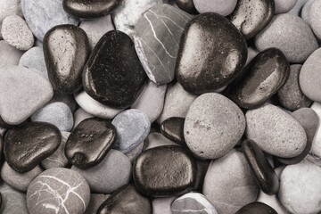 Fototapeta premium Smooth round pebbles texture background. Pebble beach