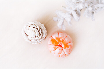 Top view Christmas and New Year decorations, pine cone, mandarin on a light background. Flat lay Handmade New Year soap. Xmas toys. Holiday concept, gifts and homemade soap