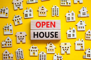 Fototapeta premium Open house symbol. Concept words 'Open house' on wooden blocks near miniature houses. Beautiful yellow background, copy space. Business and open house concept.