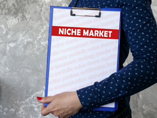 Business concept meaning NICHE MARKET with phrase on the sheet.