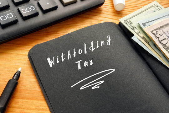  Withholding Tax sign on the sheet.