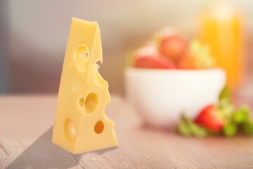 Emmental cheese triangle, Swiss cheese on the desk