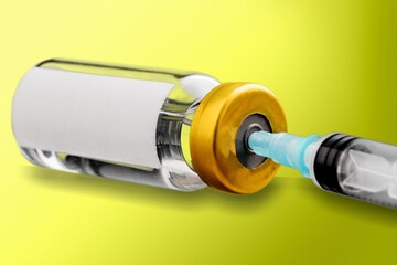 nurse draws a Covid-19 vaccine dose into a syringe with vaccine