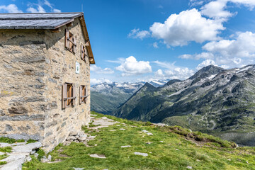 Fototapeta na wymiar Small stone alpine hut in austrian Alps