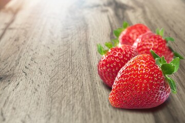 Delicious fresh red strawberries on the desk