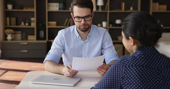 Open job competition. Male hr manager dissatisfied with cv of young female applicant get negative first impression point out on lack of experience reject in employment call next candidate on interview