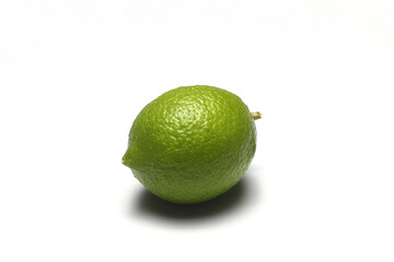 Lime green lemon isolated on white background. Citrus full focus
