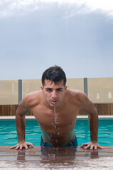 Sensual man in swimming pool