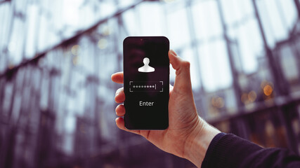 The concept of logging into an account by entering password with the Enter button in smartphone. Person hold phone.