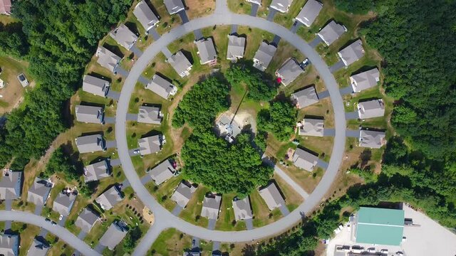 Top view of modern residential houses at a circle road in town of Londonderry, New Hampshire NH, USA. 