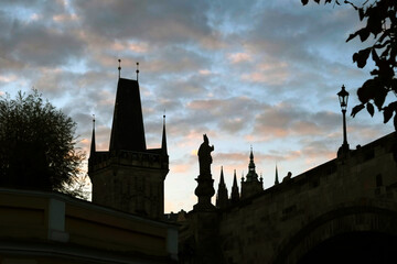 Silhouettes of the Charles Bridge on the background of sunset