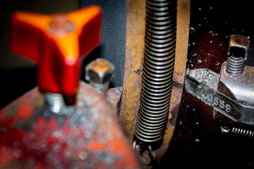 A brake rotor being resurfaced on a brake lathe.