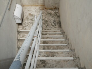 old concrete stairs with metal railing in the office.
