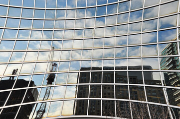tower crane reflected on concave window