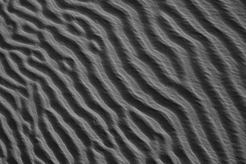 Abstract of wind-shaped patterns in sand dunes