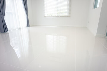 White empty space or room consist of ceramic tile floor in perspective view. Include venetian blind, curtain. Modern luxury interior home design. Look clean, bright and shiny surface for background.