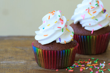 birthday cupcakes on wooden table