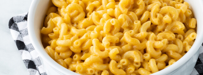 Narrow view of a dish of homemade macaroni and cheese.