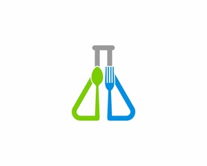 Laboratory test tube with fork and spoon in the middle