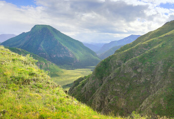 Altai mountains under a cloudy blue sky